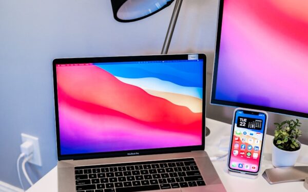 macbook pro on white table