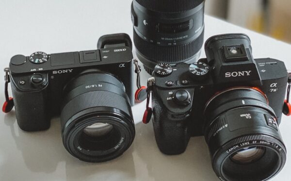 black nikon dslr camera on white table