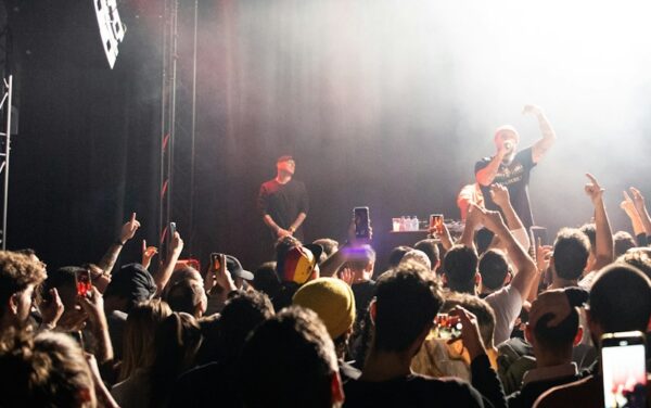 man singing on the stage photograph